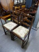 A SET OF SIX ELM LADDER BACK DINING CHAIRS WITH DROP-IN SEATS, COMPRISING A PAIR OF CARVERS