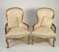 MODERN PAIR OF LOUIS XV STYLE CARVED GILTWOOD BERGERES OR EASY ARMCHAIRS, each with moulded, show-