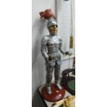 A RESIN FIGURE OF A KNIGHT IN ARMOUR