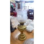 A BRASS OIL LAMP WITH OPALINE GLASS SHADE AND FUNNEL