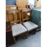 A SET OF FOUR GOOD QUALITY OAK DINING CHAIRS WITH OVERSTUFFED SEATS AND A REPRODUCTION MAHOGANY