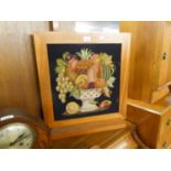 A MAHOGANY GRATE SCREEN, FRAMING A PICTORIAL NEEDLEWORK TAPESTRY OF A BOWL OF FRUIT