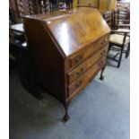 A GOOD QUALITY GEORGE III STYLE FIGURED MAHOGANY BUREAU, WITH THREE LONG DRAWERS, ON FOUR CARVED