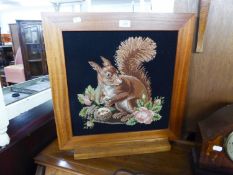 A MAHOGANY GRATE SCREEN, FRAMING A PICTORIAL NEEDLEWORK TAPESTRY OF A SQUIRREL