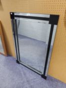 A BEVELLED EDGE WALL MIRROR, RECTANGULAR WITH BLACK AND PLAIN MIRROR GLASS FRAME, 3?3? X 2?4?