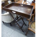 AN OAK BUTLERS TRAY, ON FOLDING STAND