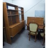 A LARGE 1970S TEAK SIDE UNIT, WITH FULL-HEIGHT PANEL ENDS SUPPORTING THE UPPER PORTION WITH