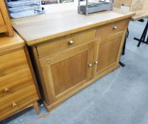 A MODERN LIGHT OAK SIDEBOARD, TWO DRAWERS OVER TWO DOORS WITH BRASS KNOB HANDLES, 4? WIDE