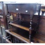 JACOBEAN STYLE OAK OCCASIONAL TABLE, THE BOX TOP WITH HINGED LID, WAVY EDGE, ON FOUR SPIRALLY