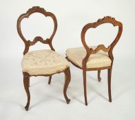 SET OF FOUR NINETEENTH CENTURY CARVED WALNUT DINING CHAIRS, each with floral cresting and beaded