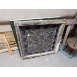 TWO SQUARE LEADED AND STAINED GLASS WINDOW PANELS, FOLIATE PATTERN (A.F.)