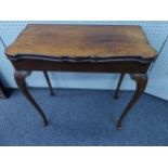 EARLY TWENTIETH CENTURY FIGURED AND CARVED WALNUT CARD TABLE IN THE QUEEN ANNE TASTE, the shaped