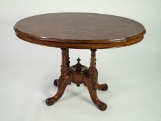 VICTORIAN BURR WALNUT OVAL LOO TABLE, the quarter cut tilt top raised on four part fluted columns