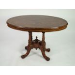 VICTORIAN BURR WALNUT OVAL LOO TABLE, the quarter cut tilt top raised on four part fluted columns