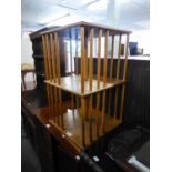 A LIGHT OAK SQUARE REVOLVING BOOKCASE, ON PLATFORM BASE, 1?4? WIDE