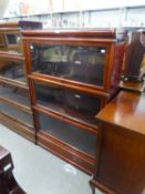 A THREE PART EARLY TWENTIETH CENTURY MAHOGANY GLOBE WERNICKE TYPE SECTIONAL BOOKCASE WITH PLAIN UP