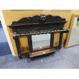 A CARVED DARK STAINED HALL WALL HANGING, WITH MIRROR AND SHELF, HAVING LIONS HEAD CARVING TO CORNICE