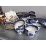 A BOOTH'S 'REAL OLD WILLOW' PATTERN BLUE AND WHITE PART TEA SERVICE, APPROX 37 PIECES