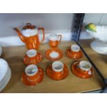 AN ORIENTAL PORCELAIN ORANGE AND OPALESCENT LUSTRE COFFEE SERVICE OF 13 PIECES; BOXED AYNSLEY