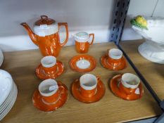 AN ORIENTAL PORCELAIN ORANGE AND OPALESCENT LUSTRE COFFEE SERVICE OF 13 PIECES; BOXED AYNSLEY