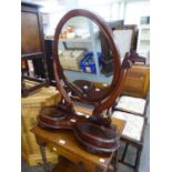 A LARGE VICTORIAN MAHOGANY OVAL SWING TOILET MIRROR, ON KIDNEY SHAPED PLATFORM BASE, WITH TWO LIDDED