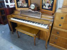A 'BALDWIN' UNUSUAL OAK CASED UPRIGHT PIANO, RAISED ON FRONT CABRIOLE  SUPPORTS AND AN OBLONG OAK