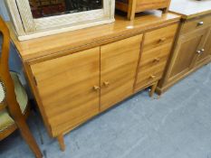 G-PLAN STYLE TEAK WOOD SIDE CABINET WITH TWO DOOR CUPBOARD NEXT TO A NEST OF THREE SHORT DRAWERS, ON