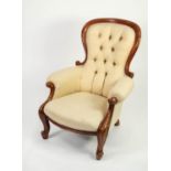 VICTORIAN CARVED WALNUT EASY ARMCHAIR, the deep buttoned and waisted back with moulded outline,