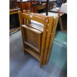 A SET OF THREE SLATTED WOODEN FOLDING CHAIRS (3)