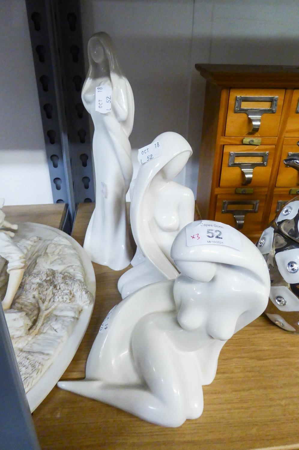 THREE ?ENESCO? WHITE CHINA STYLISED FEMALE FIGURES