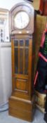A 1930's OAK CASED GRANDMOTHER CLOCK, WITH GLAZED WAIST DOOR, SPRING DRIVEN 8 DAY CHIMING AND