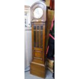 A 1930's OAK CASED GRANDMOTHER CLOCK, WITH GLAZED WAIST DOOR, SPRING DRIVEN 8 DAY CHIMING AND