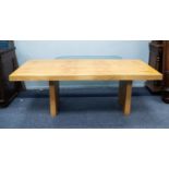 MODERN HEALS FIGURED OAK DINING TABLE, the oblong top with stepped edge, raised on conforming slab