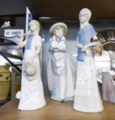 NAO, SPANISH PORCELAIN, GIRL CARRYING TWO PUPPIES AND TWO FIGURES IN SIMILAR TASTE (3)