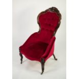 NINETEENTH CENTURY CARVED WALNUT, GRAIN PAINTED AS ROSEWOOD, LADY?S EASY ARMCHAIR, the buttoned