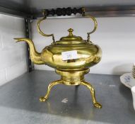 A LATE VICTORIAN BRASS TEA KETTLE WITH FIXED IN PART TURNED BLACKWOOD OVER-HEAD HANDLE, REMOVABLE