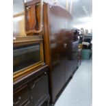 A 1930's MAHOGANY PART BEDROOM SUITE OF TWO DOOR WARDROBE, A DRESSING TABLE WITH STOOL AND A CABINET