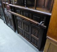 JACOBEAN STYLE STAINED PINE BAR COUNTER WITH NINE FRAMED PANELS TO THE FRONT, WITH HAND RAIL, OPEN