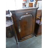 A LATE EIGHTEENTH CENTURY FIELDED PANEL-FRONT CORNER CUPBOARD