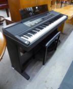 A YAMAHA CLAVINONA CVP-8 ELECTRIC ORGAN AND STOOL