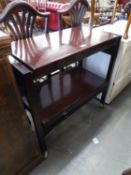 A MAHOGANY TWO TIER DINNER WAGON, ADJUSTING TO FORM A TABLE TOP