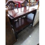 A MAHOGANY TWO TIER DINNER WAGON, ADJUSTING TO FORM A TABLE TOP