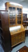 AN EDWARDIAN MAHOGANY BUREAU BOOKCASE