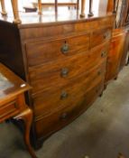 A NINETEENTH CENTURY MAHOGANY BOW-FRONT CHEST OF DRAWERS ON BRACKET FEET