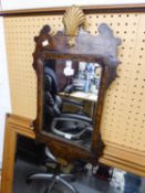 A SMALL QUEEN ANNE REVIVAL WALNUT AND PARCEL WALL MIRROR, IN GILT GESSO FRAME WITH FLORIATED