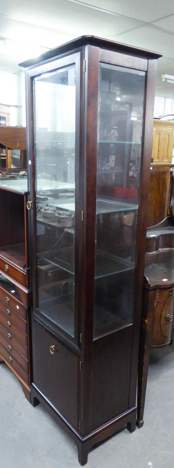 A TALL NARROW MAHOGANY STAG DISPLAY CABINET WITH GLASS SHELVES