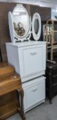 A PAIR OF WHITE FINISH BEDSIDE CUPBOARDS AND A TRIPLE OVAL TOILET MIRROR IN WHITE AND GILT FRAME