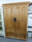 A PINE WARDROBE, WITH TWO DOORS OVER TWO DRAWERS, 4?4? WIDE AND THE MATCHING PINE CHEST OF THREE