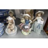 TWO LLADRO FIGURES OF YOUNG GIRLS, AND A LLADRO GROUP FIGURE OF A YOUNG GIRL TAKING A BATH (3)