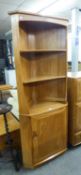 ERCOL LIGHT ELM DOUBLE CORNER CUPBOARD, THE UPPER PORTION WITH OPEN SHELVES, CUPBOARD BASE